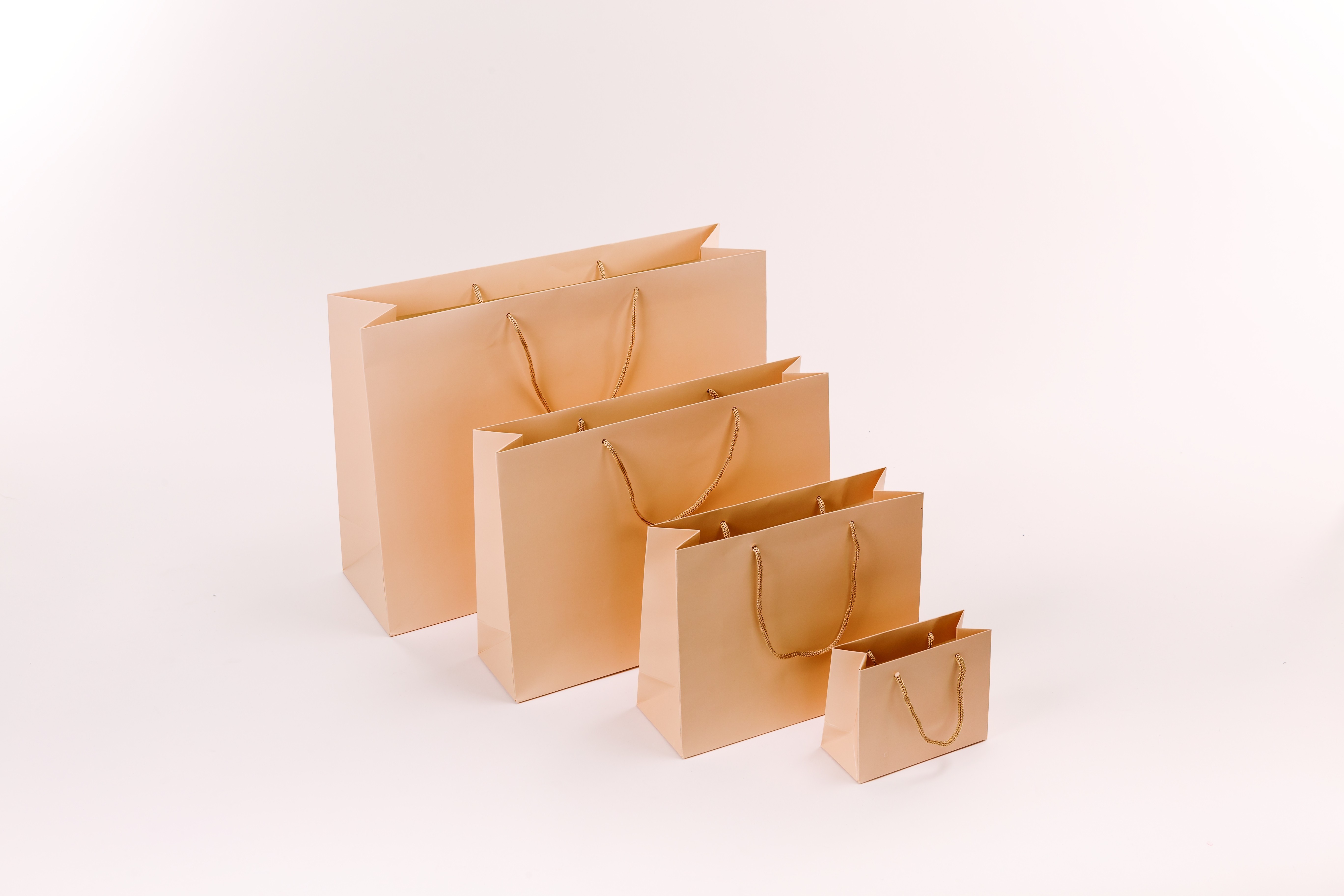 Bolsa de papel plastificado con asa de cordón 11x14x6 cm